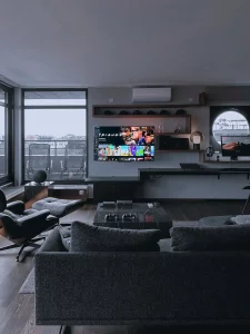 a living room filled with furniture and a flat screen tv